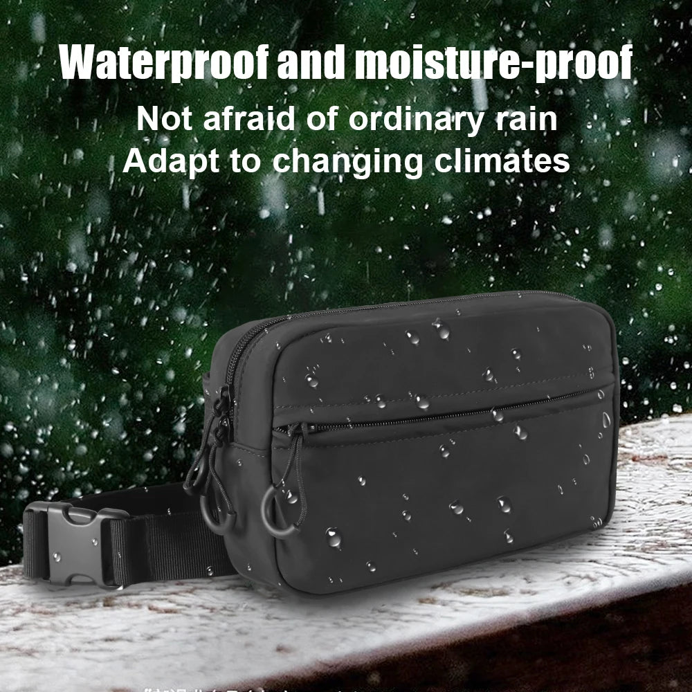 A dark gray tactical concealed carry fanny pack is shown against a background of rain.