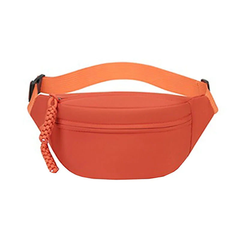 Orange anti-theft waist pack designed for travel and running.