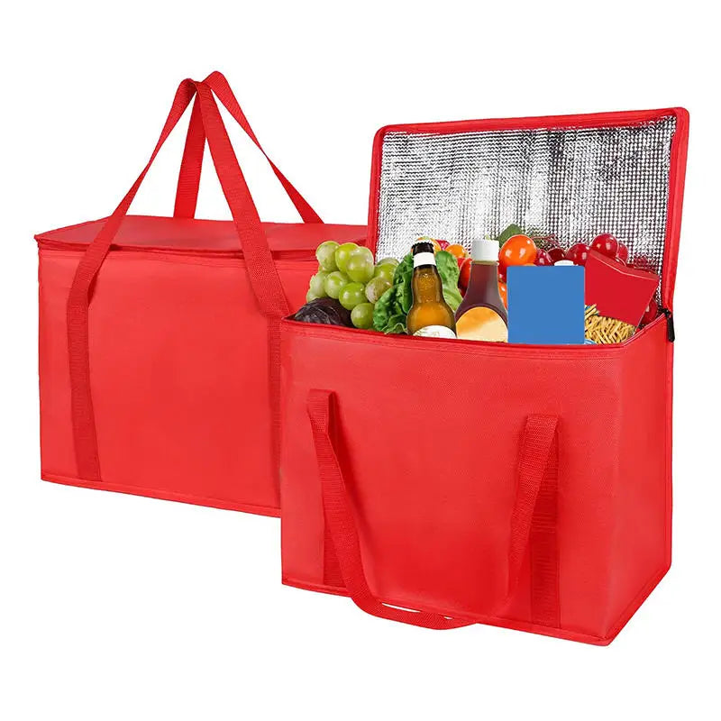 A red foldable insulated grocery and food cooler bag with a mesh lid showing fresh produce.