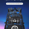 A blue and black graffiti-themed backpack with a white graphic of a boy playing a guitar resting on a purple surface.