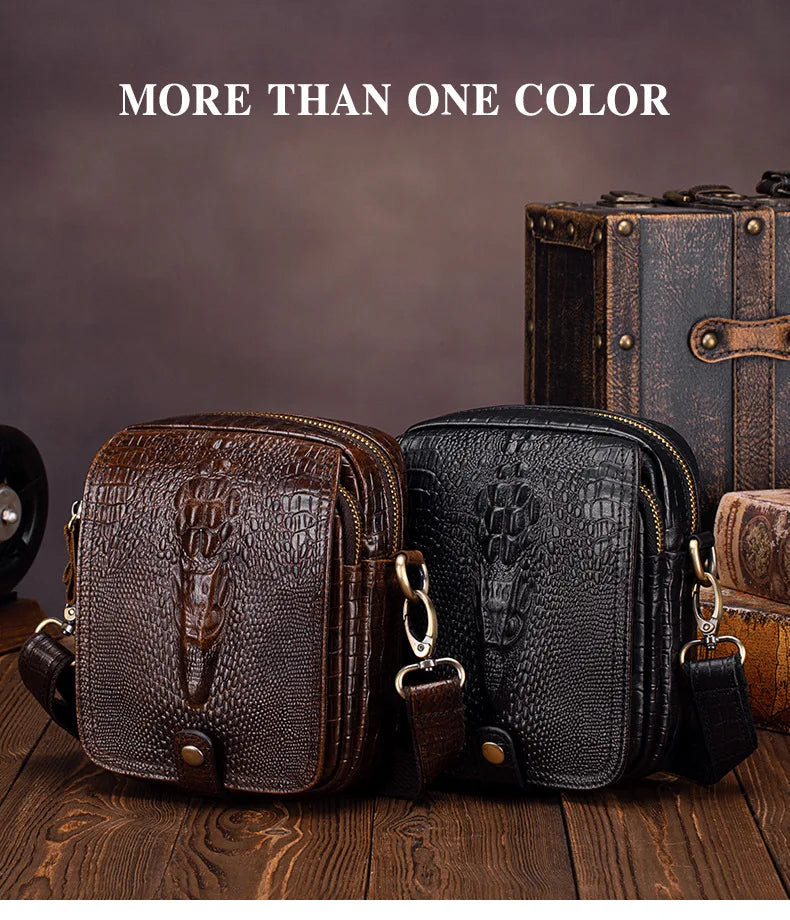 Two brown and black genuine cow leather crossbody bags displayed on a wooden surface with an antique box in the background.