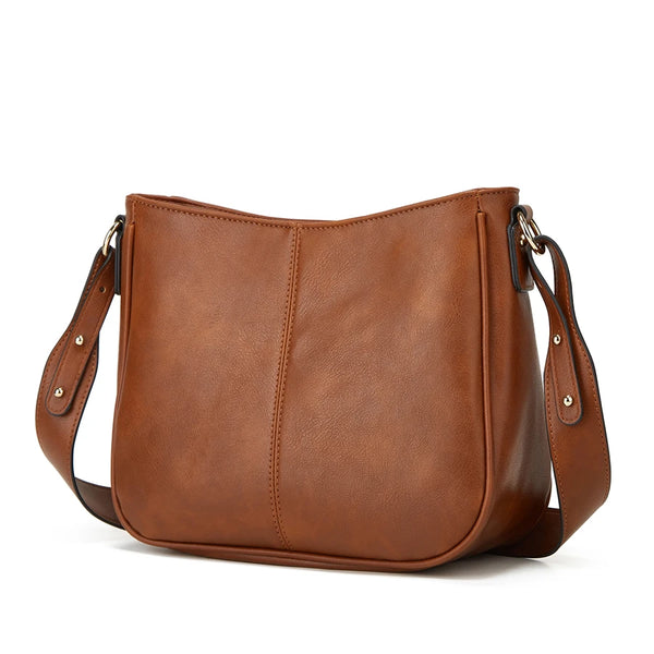 Bolso cruz de cuero PU marrón con solapa y correa de cuero.