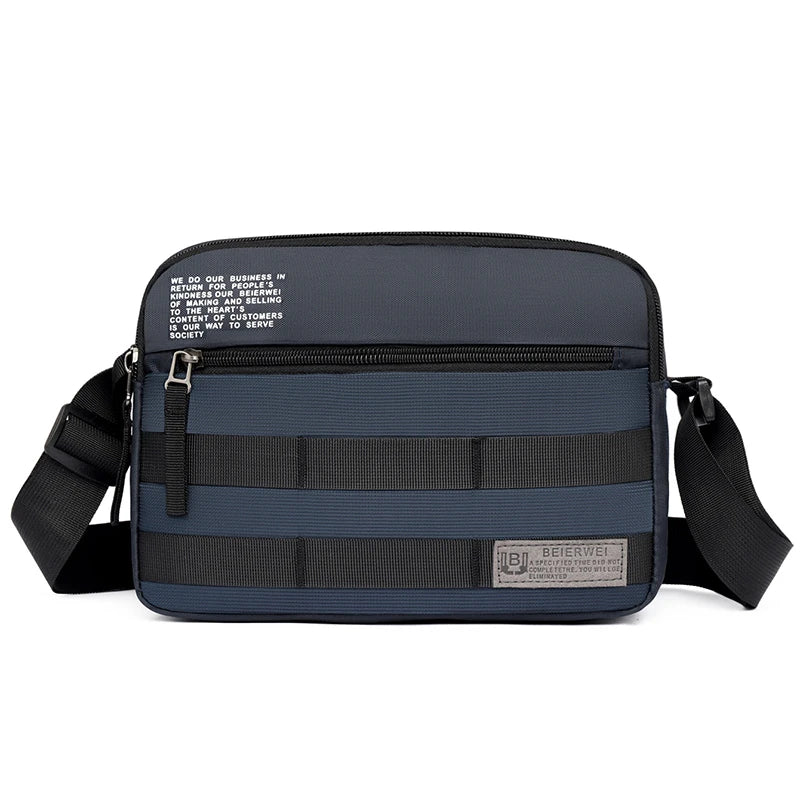A dark blue nylon shoulder bag with black straps and a logo patch on the front.