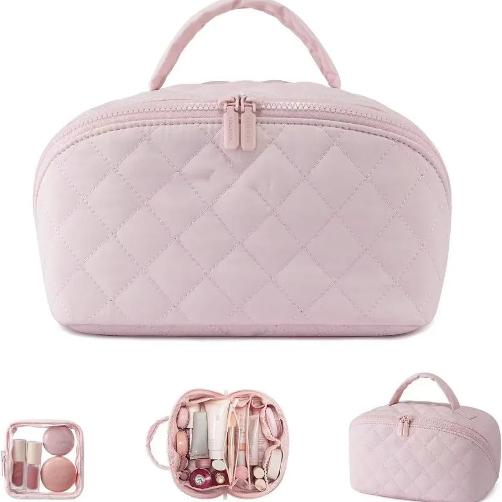 A pink lay-flat water-resistant makeup organizer bag with a quilted texture and a zippered compartment.