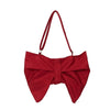 A vibrant red pleated bow crossbody tote bag.