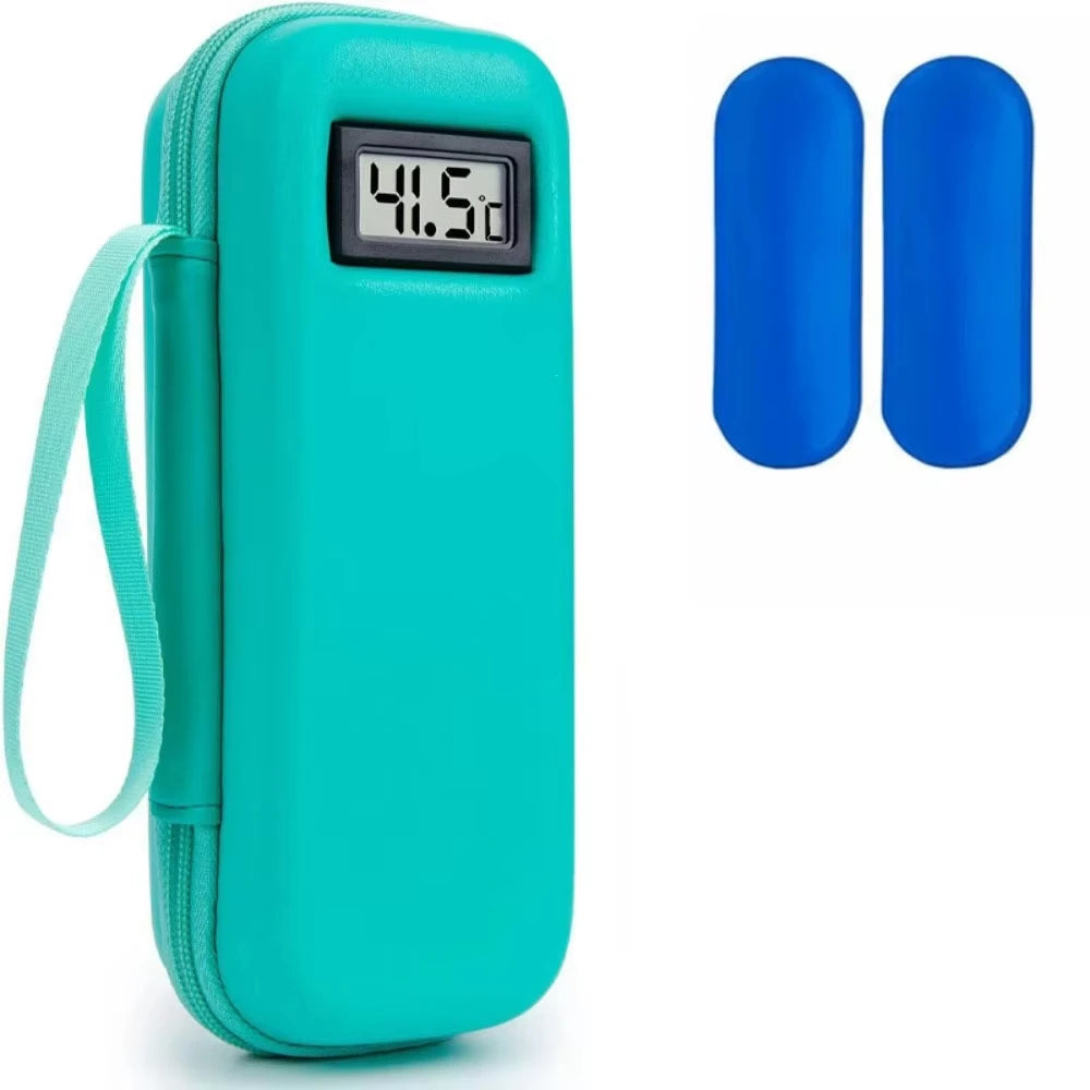 A teal insulin cooler travel case with a digital thermometer display, shown next to two blue silicone inserts.
