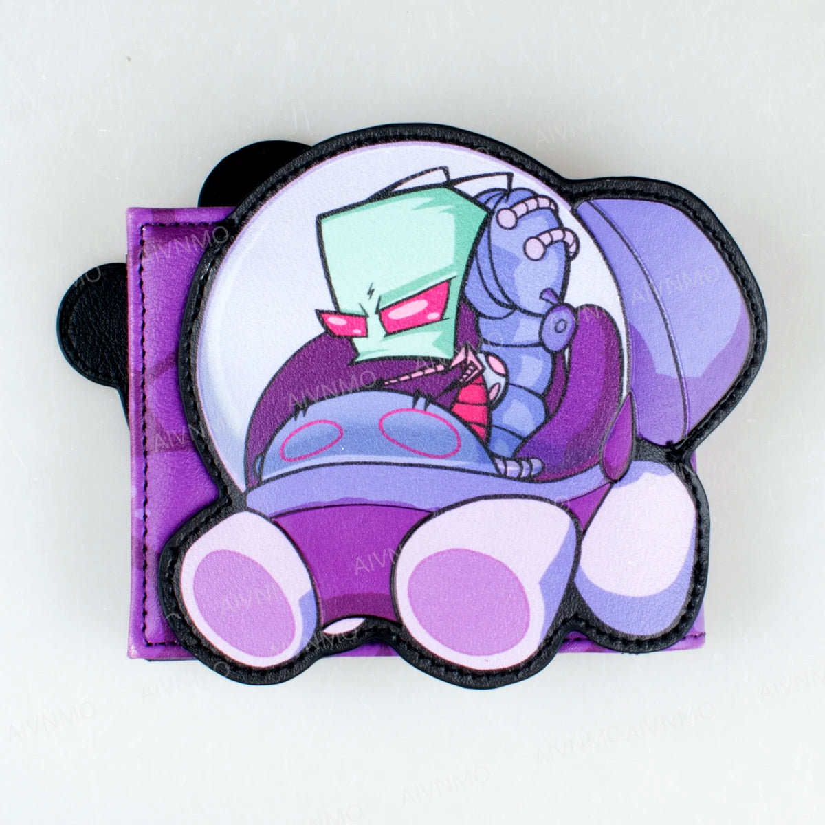 Cartera porta tarjetas de cartón morado y turquesa con un personaje azul enojado.