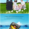 A black insulated thermal cooler backpack is shown on a grassy field with a man and woman, highlighting its capacity and wate