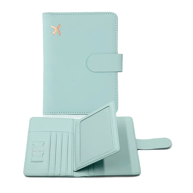 A light mint green PU leather passport holder with credit card slots and a gold-toned logo.