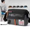 Black waterproof nylon crossbody bag with orange accents displayed against a gray background.