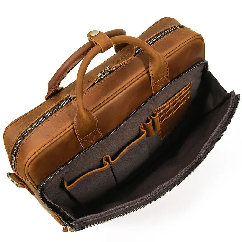 A brown vintage genuine leather briefcase with a padded interior and leather straps.