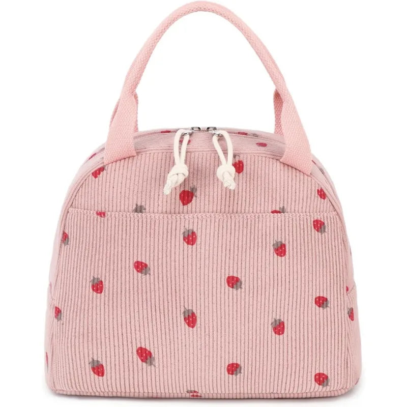 A pink corduroy lunch bag for kids with a strawberry pattern and fabric loops.