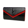 Black alligator pattern leather clutch bag with a red accent detail