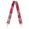 A pink floral patterned nylon crossbody bag strap with gold hardware.