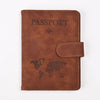 A brown genuine PU leather passport and ticket wallet cover with the word PASSPORT and a world map design.