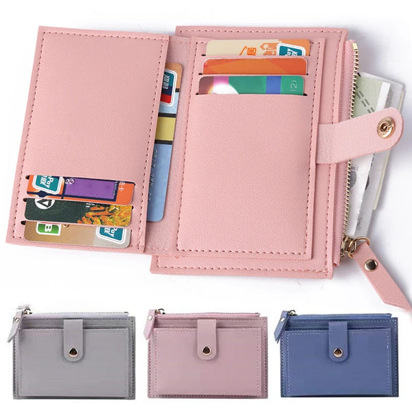 A pink leather wallet with a card holder and coin pocket displaying various cards.