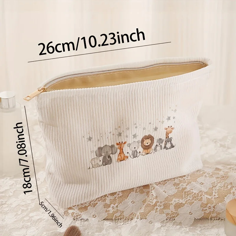 White corduroy makeup storage pouch with a floral pattern shown lying on lace fabric.