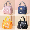 A set of four cartoon insulated lunch bags in pink, blue, orange, and black featuring cute animal faces.