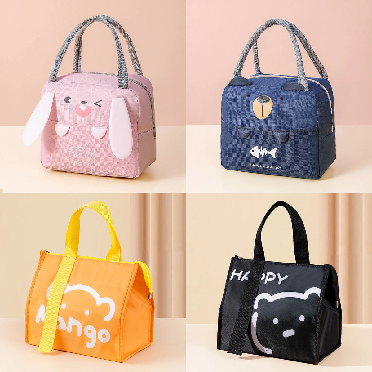 A set of four cartoon insulated lunch bags in pink, blue, orange, and black featuring cute animal faces.