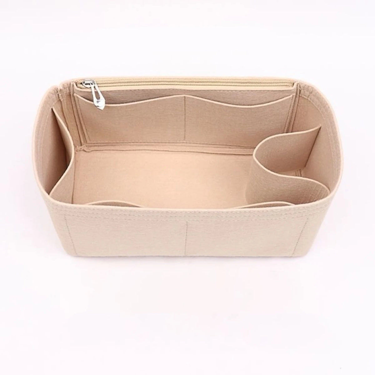 A light beige felt purse organizer with internal compartments and a zipper closure.
