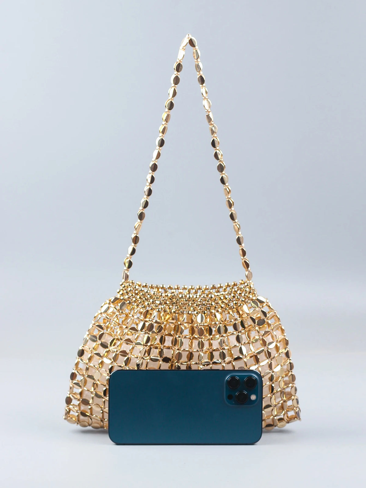 A handmade dumpling bag featuring gold and silver beads, displayed against a light gray background.