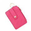 A bright pink quilted PU leather card holder wallet with a gold-tone bangle and tassel.