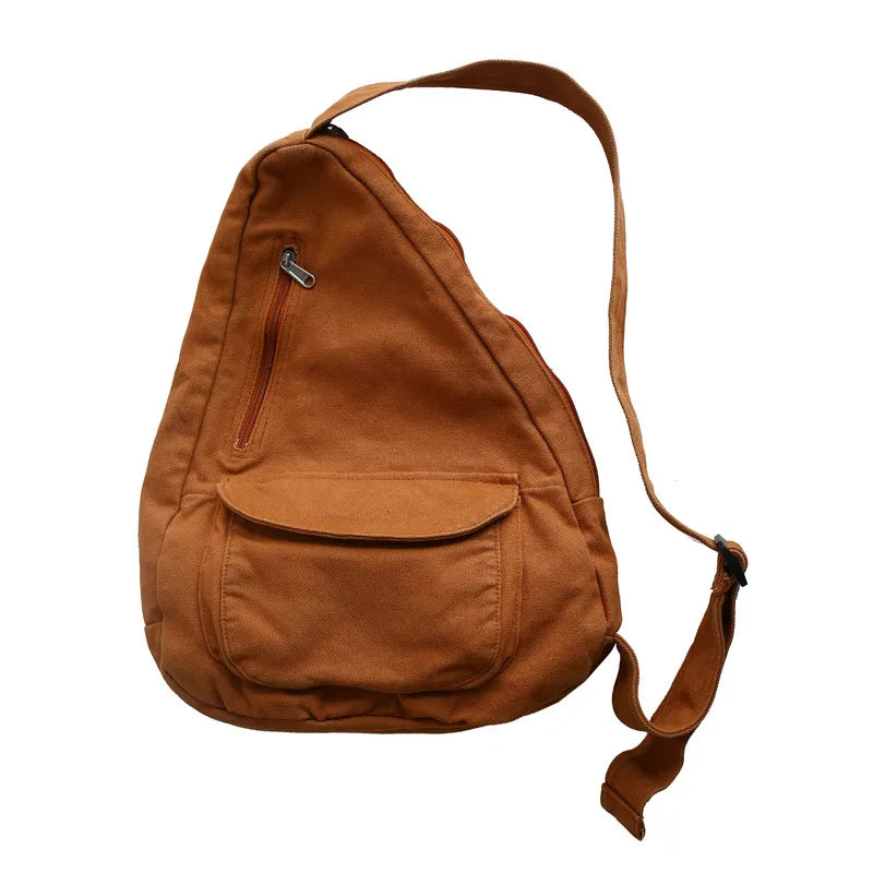 A brown canvas crossbody shoulder bag with a flap and multiple pockets.