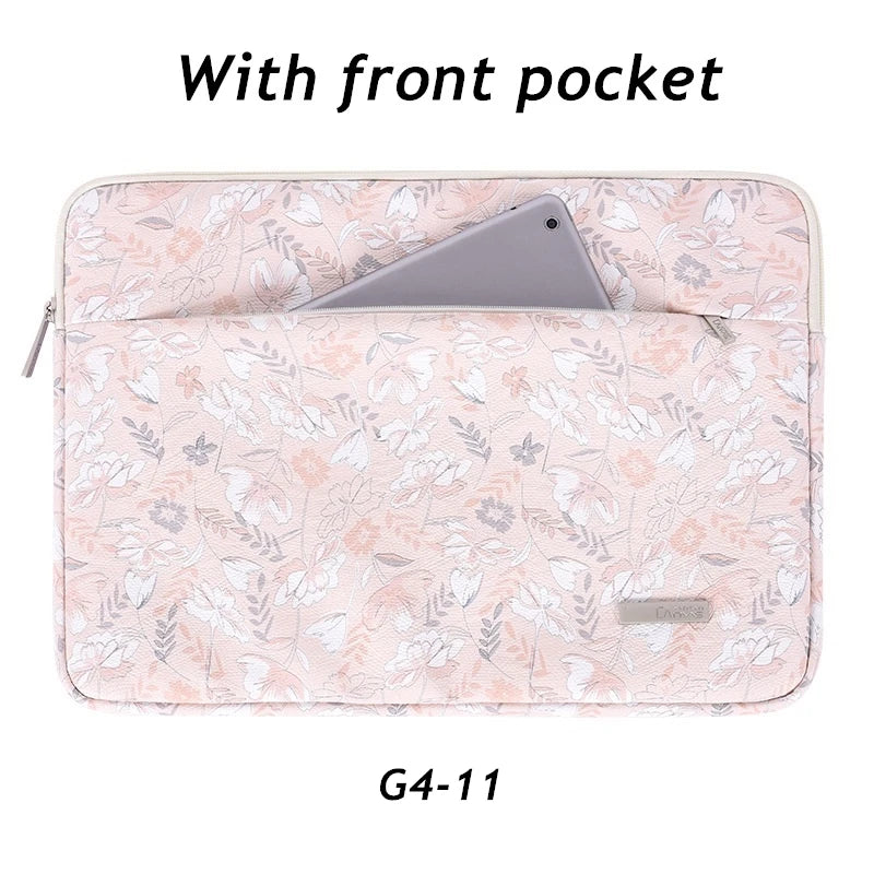 A light pink floral laptop sleeve with a front pocket, designed for a MacBook Pro.
