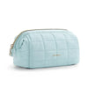 Light blue padded makeup bag with a quilted texture and wide-open design