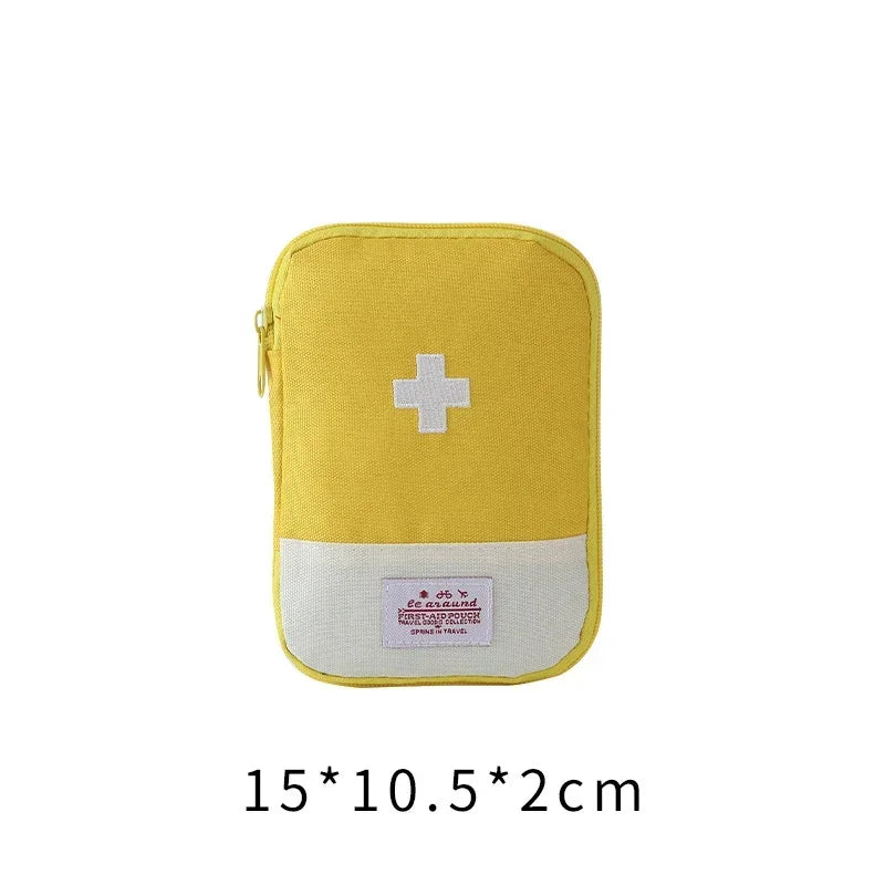 Yellow portable first aid kit storage bag with a white cross emblem and a light gray bottom section