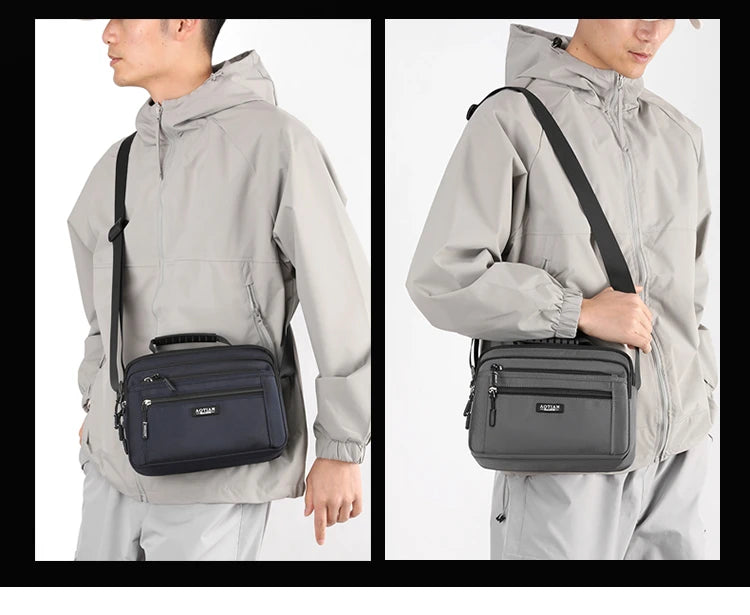 A man wears a gray waterproof jacket with a black crossbody messenger bag attached to the side.