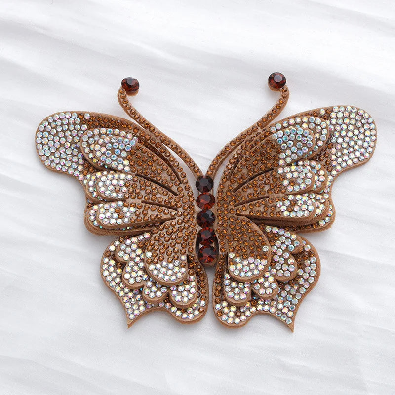 A detailed decorative rhinestone butterfly applique sticker with brown and gold accents.