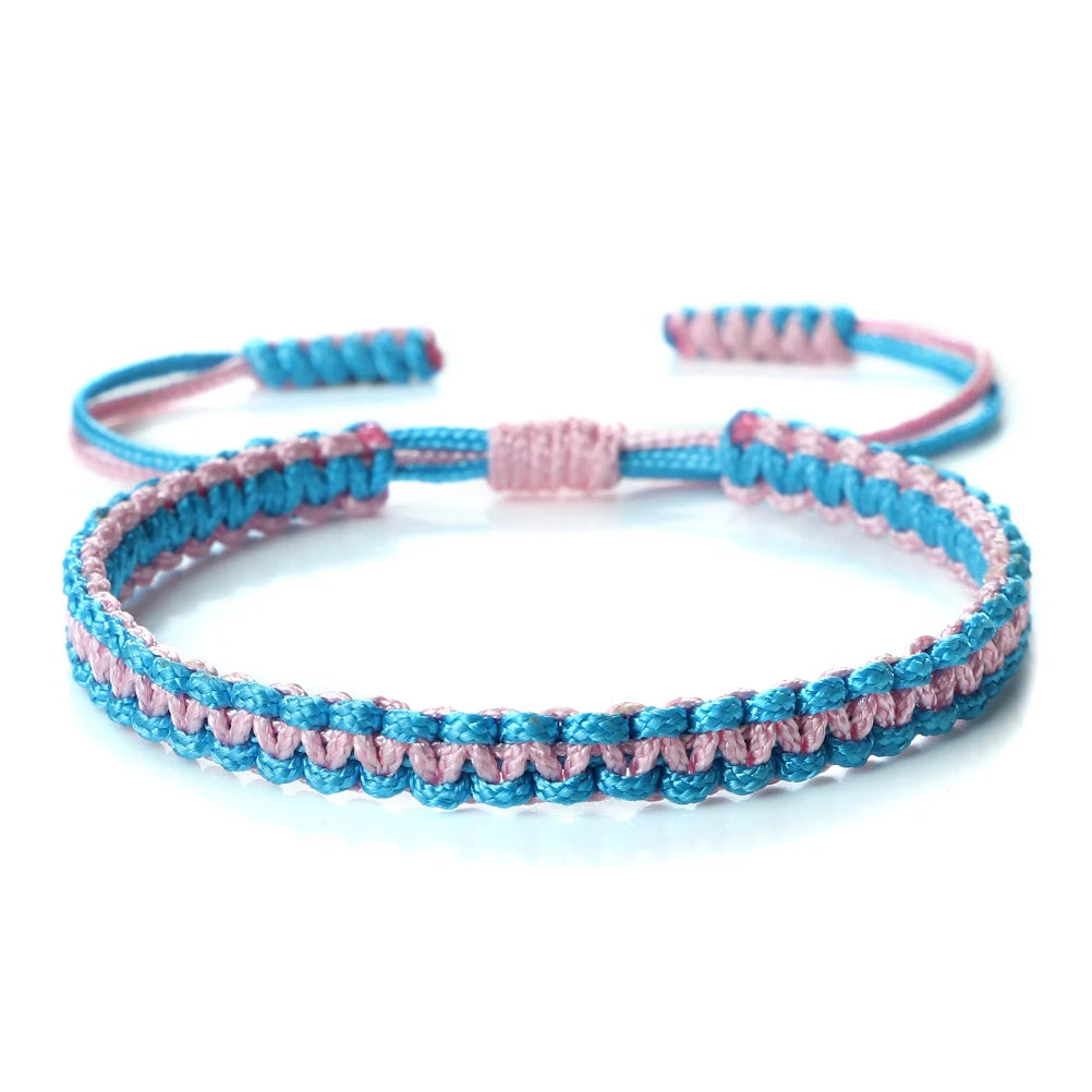 Handmade braided rope bracelet featuring pink and blue threads.
