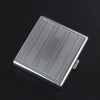 A silver decorative metal cigarette storage box with a textured surface and a small clasp.