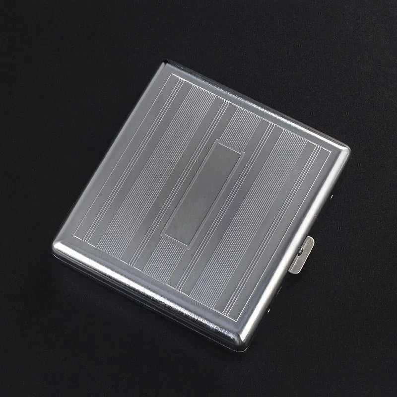 A silver decorative metal cigarette storage box with a textured surface and a small clasp.