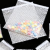 Clear self-sealing bubble mailer bags filled with colorful protective cushioning cubes