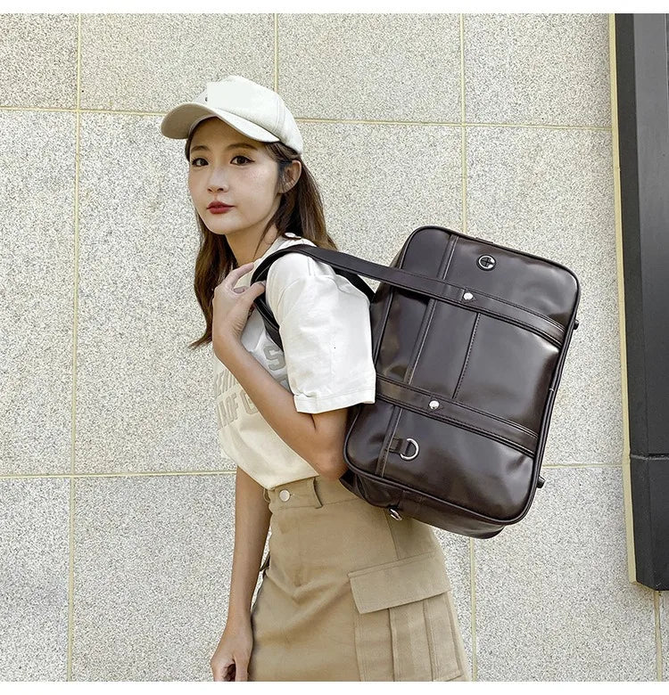 A young woman wearing a white cap and beige outfit holds a brown leather shoulder bag.