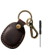 Brown MagSafe card wallet with a built-in pocket for an AirTag, attached to a key ring.