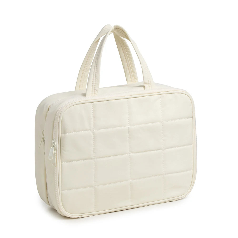 Sac organisateur de cosmétiques matelassé de couleur crème avec anses