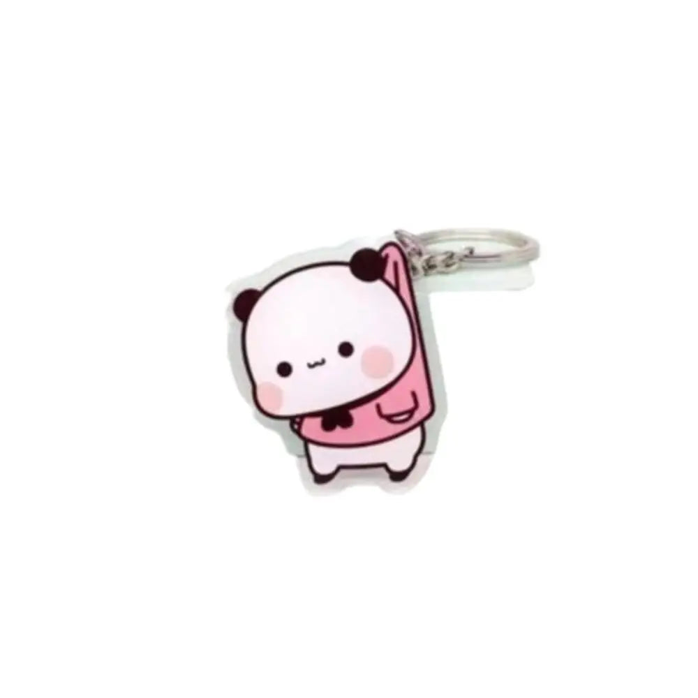 A pink and white cartoon character keychain charm made of resin.