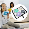 A young girl is sitting on the floor with an open storage wallet case containing multiple discs.