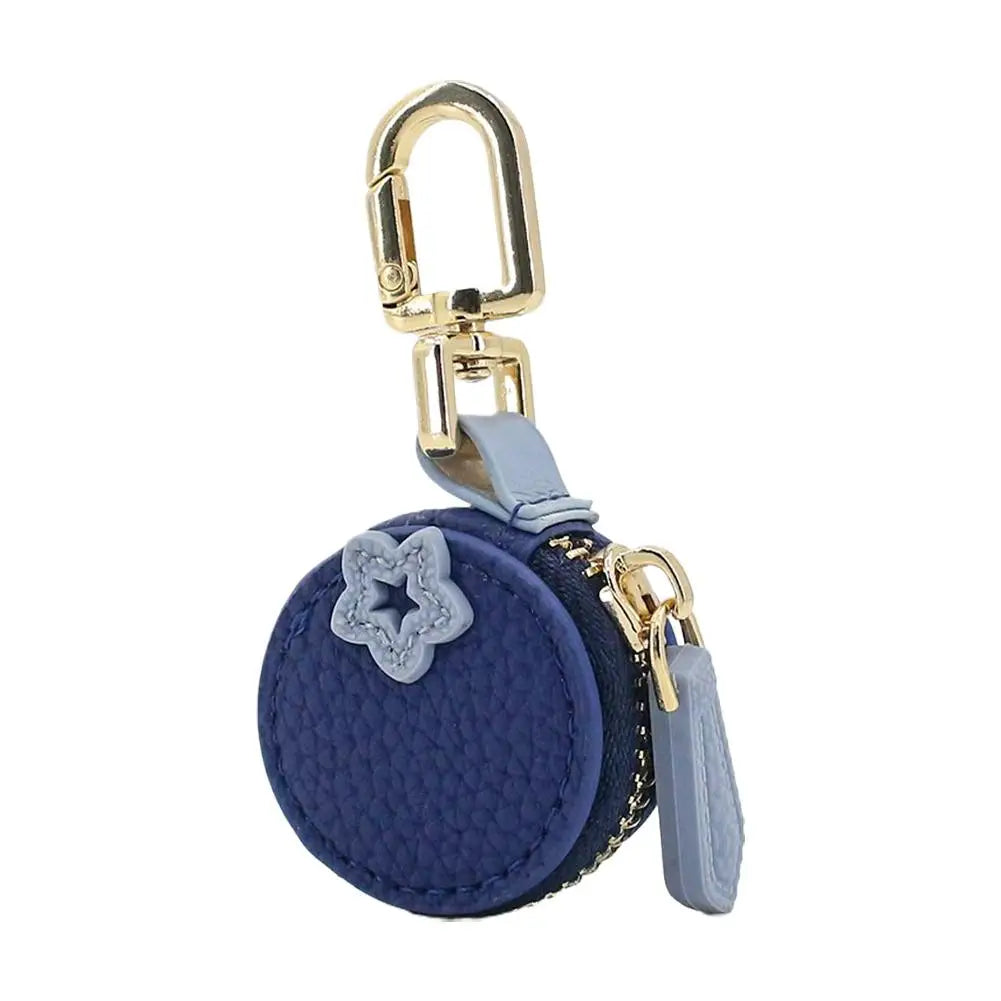 Marineblaue Frucht-Anhänger-Geldbörse Schlüsselanhänger mit goldener Schnalle und hellblauer Stoff.