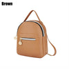 A brown waterproof PU mini backpack with a zippered pocket and a long strap.