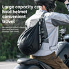 A person wearing a helmet is carrying a black multifunctional backpack on their back while riding a motorcycle.