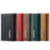 A row of ten trifold magnetic card holder wallets in various colors including black, red, olive green, and tan.