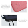 A pink Oxford leather laptop sleeve showing its waterproof and scratch resistant features and a metal double zipper.