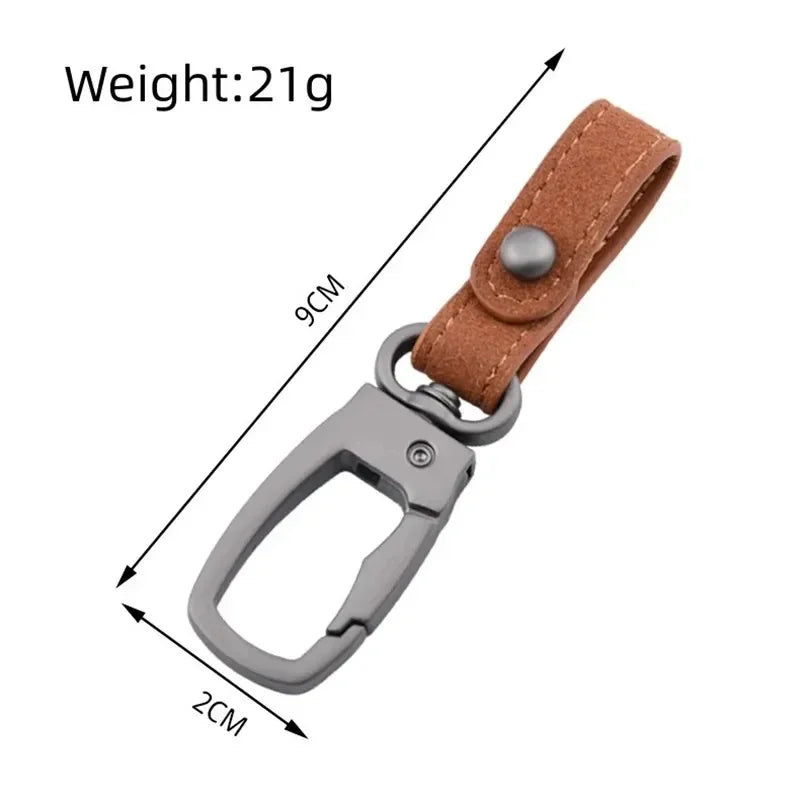 A brown genuine leather keyring keychain with a silver clasp and a small tag.