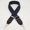 A dark blue braided nylon bag strap with gold-toned metal hooks.