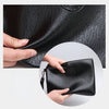 A hand is holding a black PU leather men's clutch wallet.