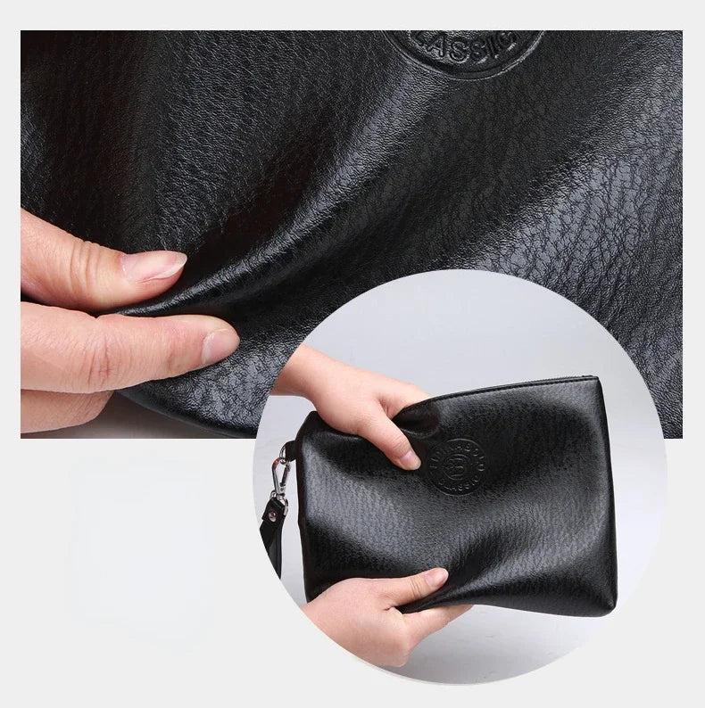 A hand is holding a black PU leather men's clutch wallet.
